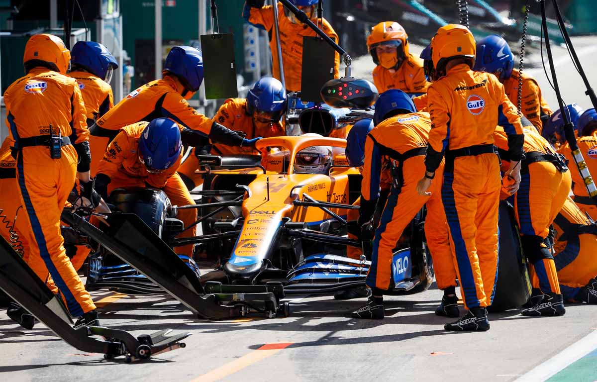 Mclaren F1 team performing a pit stop(Taken from: https://www.planetf1.com/news/mclaren-lando-norris-slow-pit-stop/)